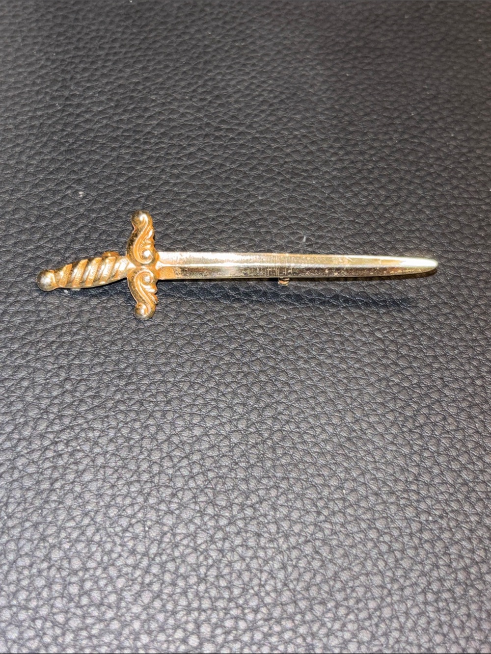 Vintage gold tone sword brooch